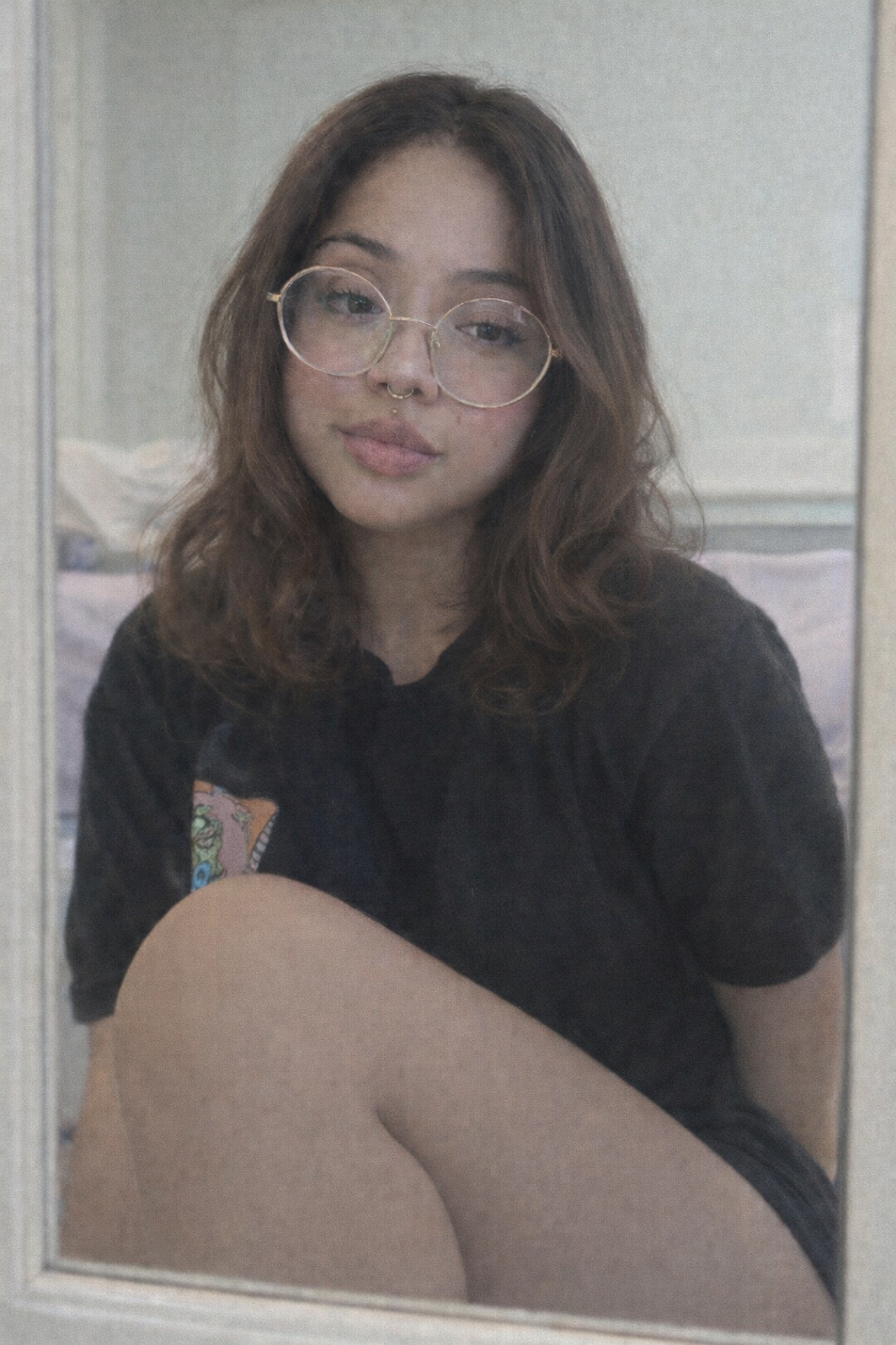 Portrait of Lupita with hand-drawn X marks over both eyes.